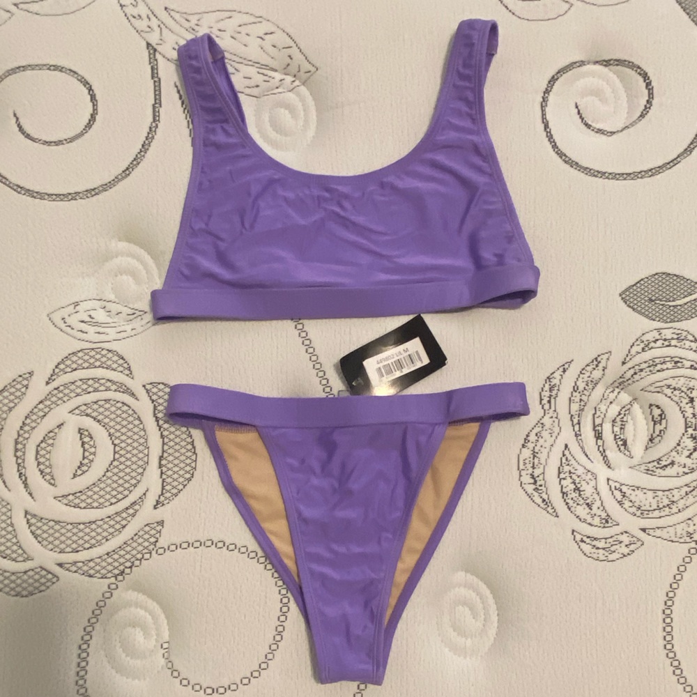 Bran new with tags purple swimsuit bikini M